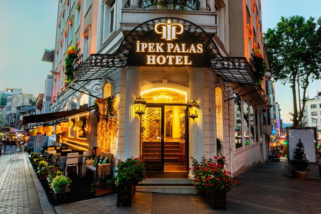 a building with a sign for a hotel at Hotel Ipek Palas in Istanbul