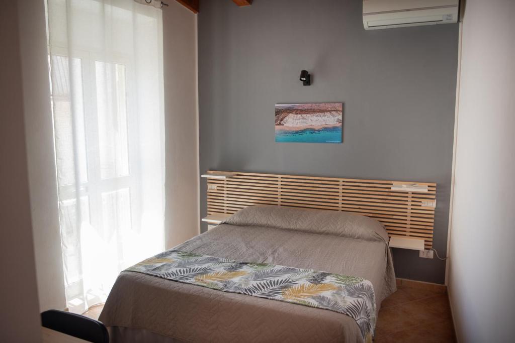 Postel nebo postele na pokoji v ubytování La Casetta di Giorgio