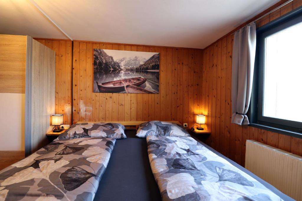 Postel nebo postele na pokoji v ubytování Hus8 Krumbach