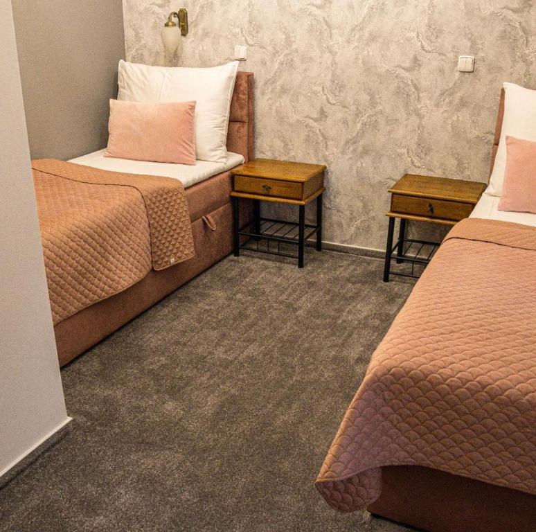 Postel nebo postele na pokoji v ubytování Hotel Litovel