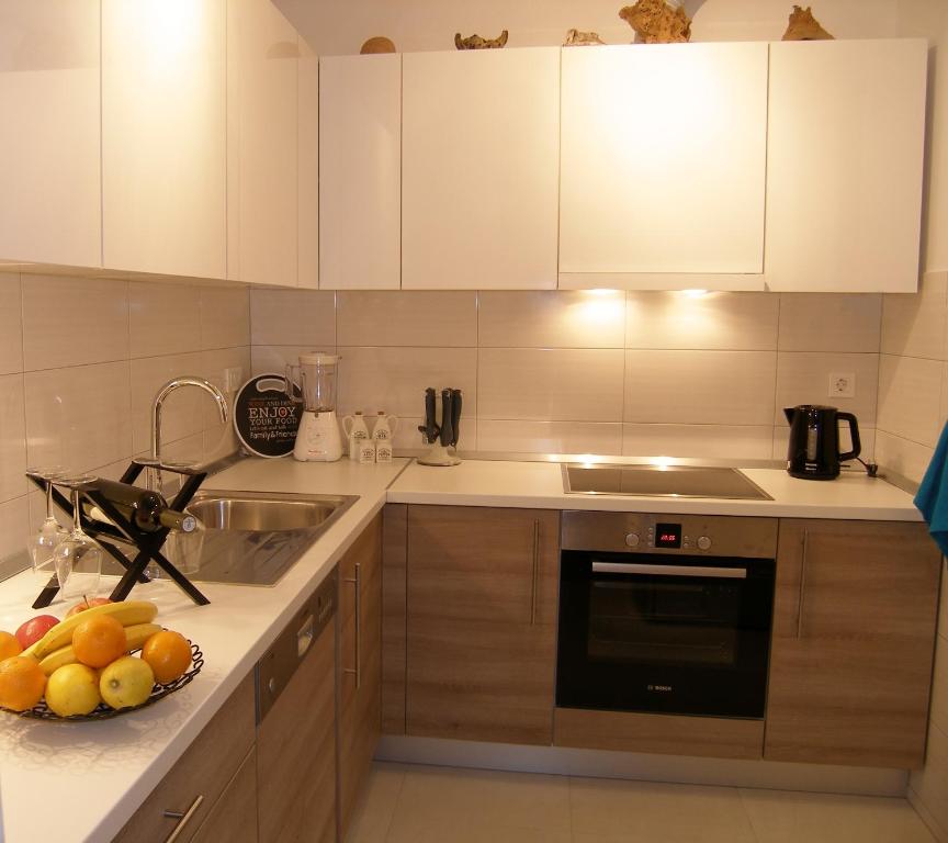 Kuchyňa alebo kuchynka v ubytovaní Momentum Apartment
