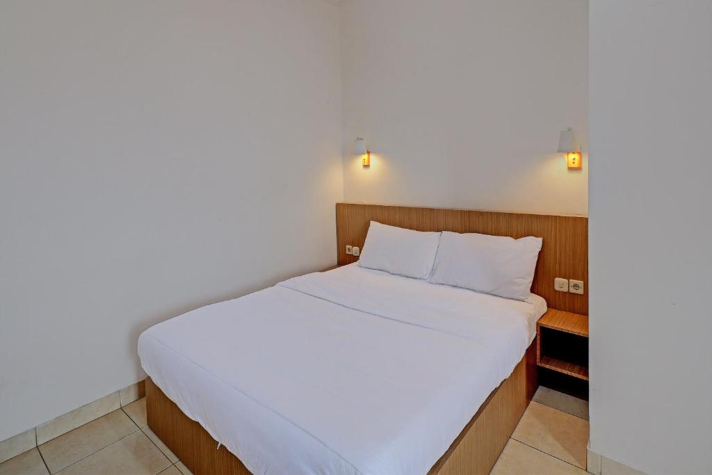 Postel nebo postele na pokoji v ubytování Guest House Simalem