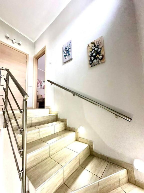 a staircase in a home with a stair railing at ENDLESS BLUE Dream Villa in Paleo Tsifliki