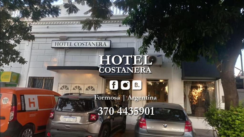 two cars parked in front of a hotel costanza at Hotel Costanera in Formosa