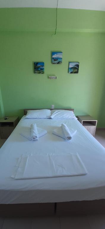 Postel nebo postele na pokoji v ubytování Pansion Platana