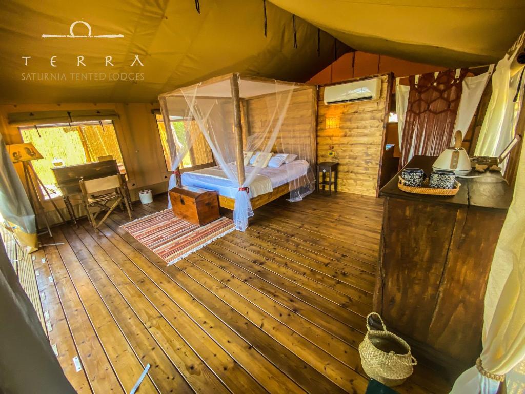 an aerial view of a bedroom in a tent at TERRA - Saturnia tented lodges in Saturnia