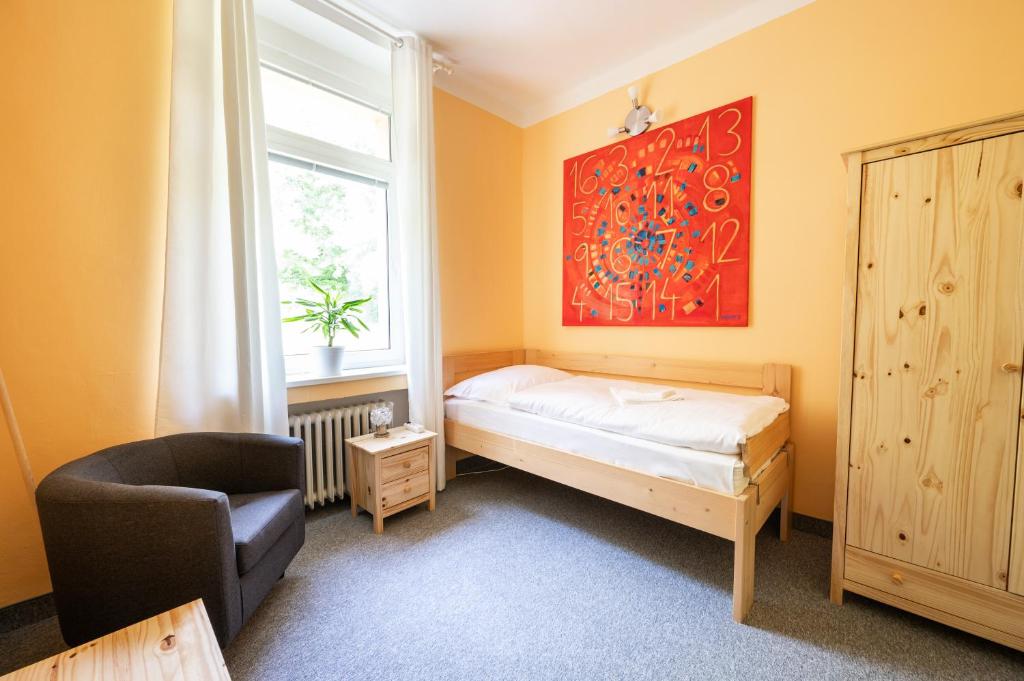 Postel nebo postele na pokoji v ubytování Lázně Meziboří