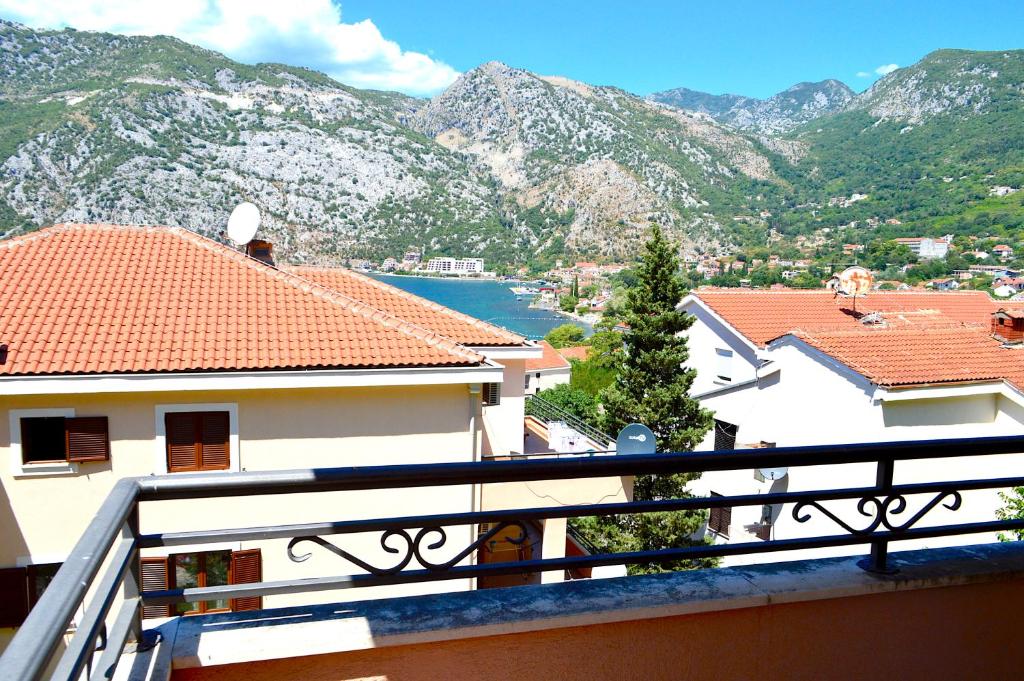 a view from the balcony of a house with mountains at Apartments Risan Club Family in Risan