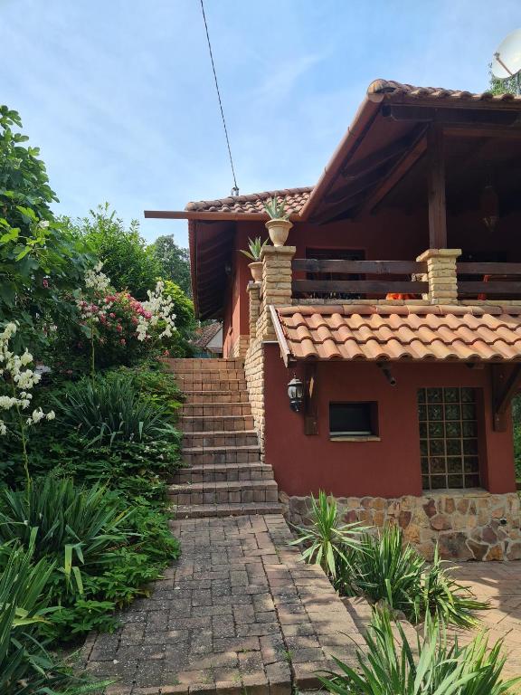 a house with a stone path leading up to it at Diana Apartman in Balatonszepezd