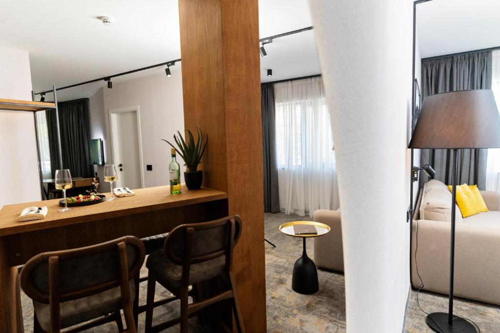 a hotel room with a desk and a bed at MM Boutique Hotel in Burgas