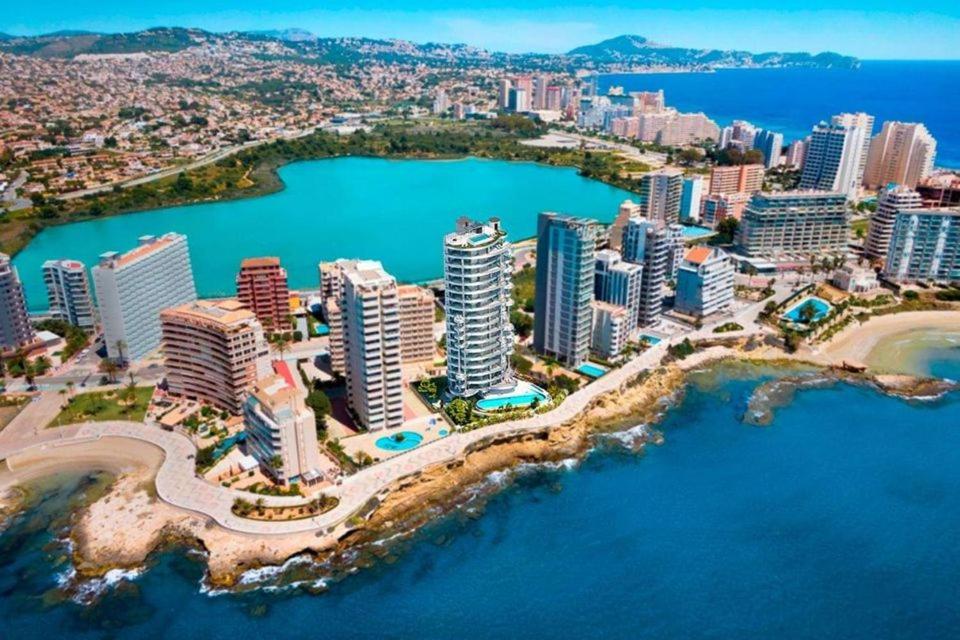 an aerial view of a city with buildings and water at Selene in Calpe