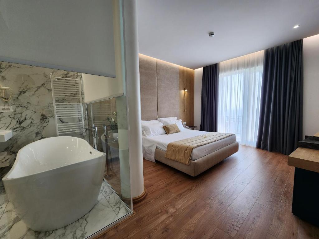 Postel nebo postele na pokoji v ubytování Hotel Gold