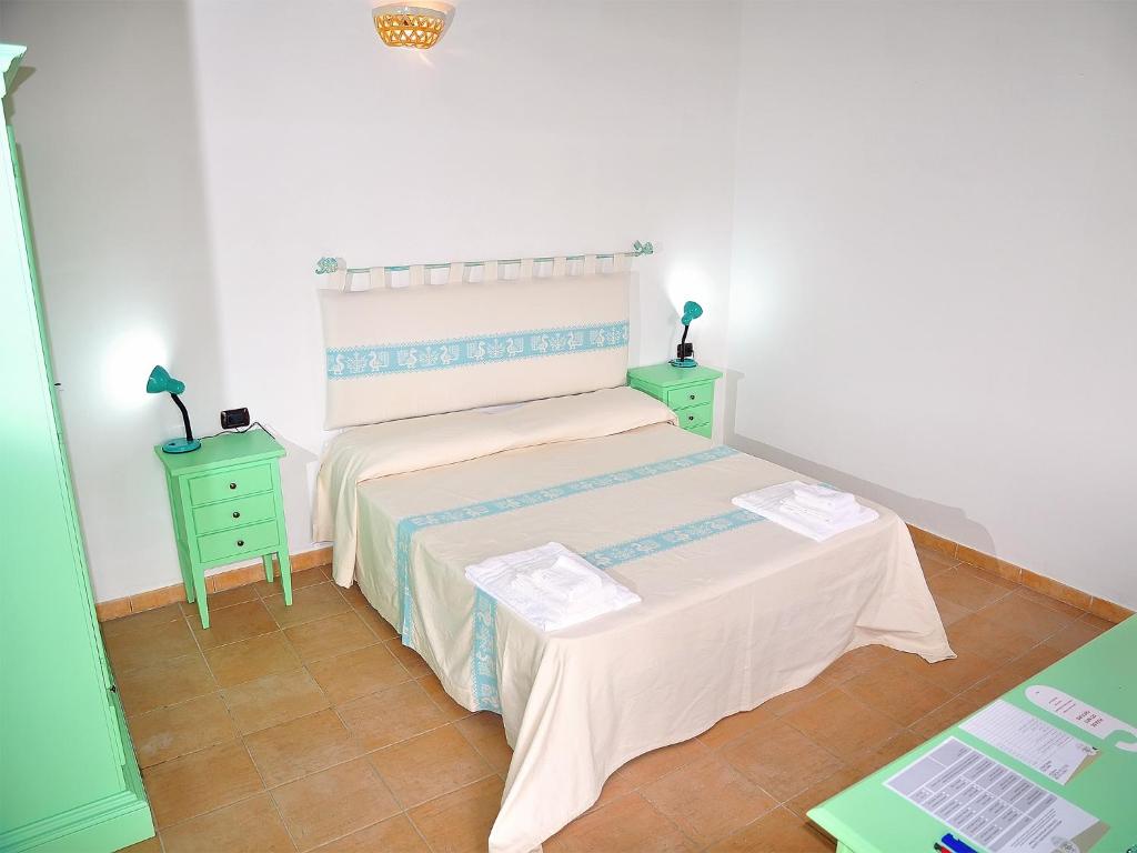 Postel nebo postele na pokoji v ubytování Sa Prata Hotel & Resort