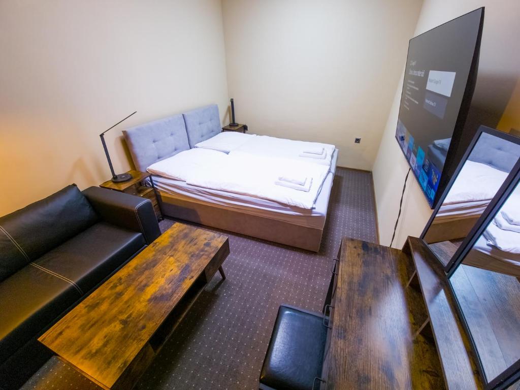 Voodi või voodid majutusasutuse Aparthotel Olympland toas