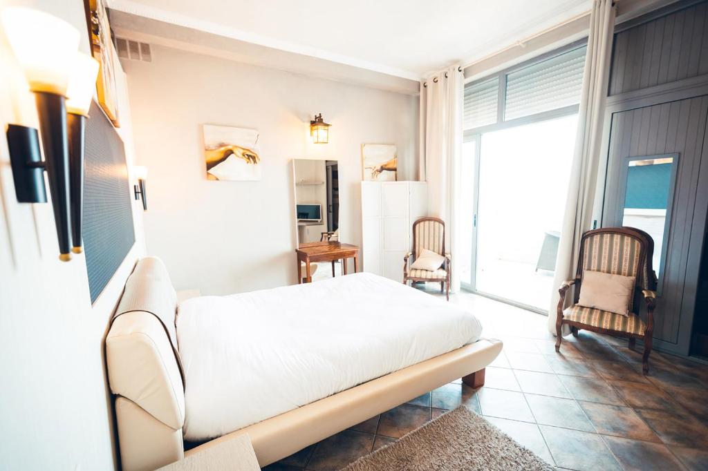 Postel nebo postele na pokoji v ubytování Marina D'oro