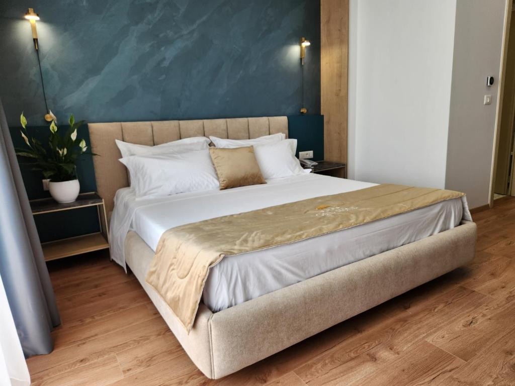 Postel nebo postele na pokoji v ubytování Hotel Gold