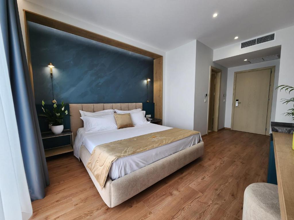 Postel nebo postele na pokoji v ubytování Hotel Gold