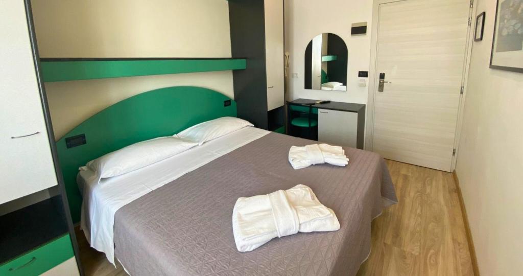 Postel nebo postele na pokoji v ubytování Hotel Tre Stelle