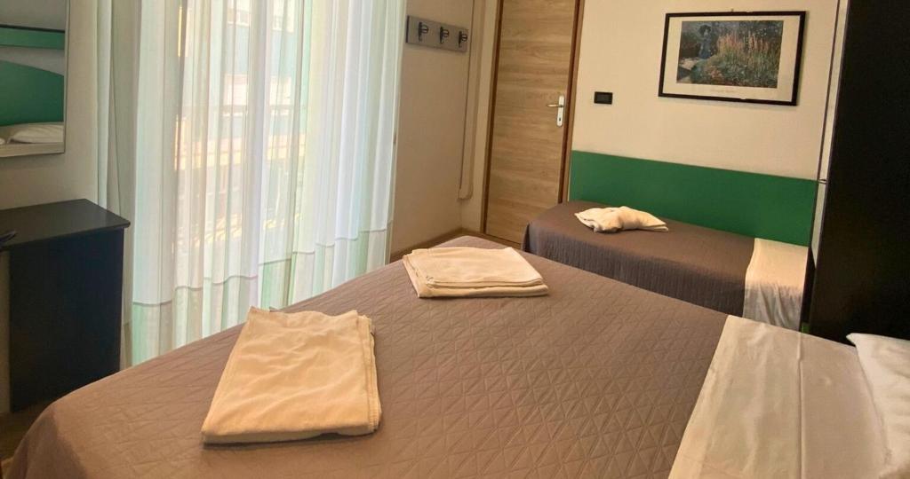 Postel nebo postele na pokoji v ubytování Hotel Tre Stelle