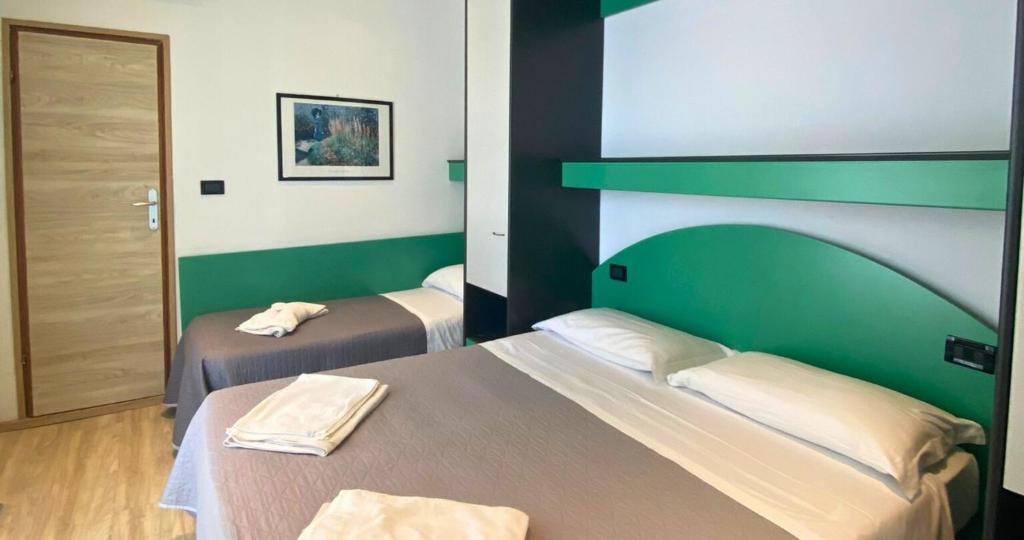 Postel nebo postele na pokoji v ubytování Hotel Tre Stelle