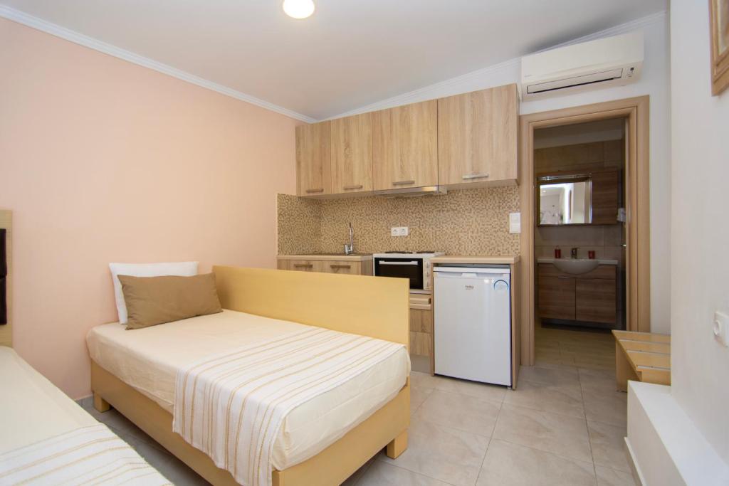 Kuchyň nebo kuchyňský kout v ubytování hotelsunnybeachgr