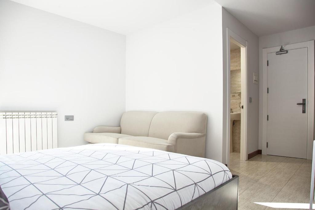 Postel nebo postele na pokoji v ubytování HOSTAL FONTAÑAN
