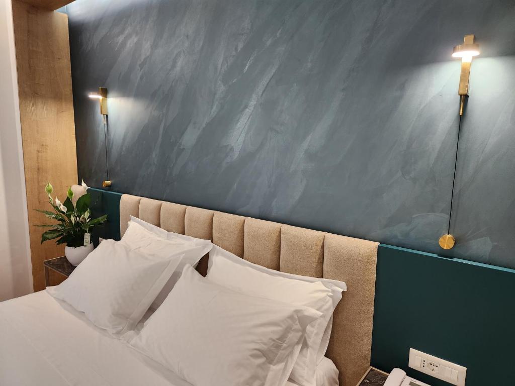 Postel nebo postele na pokoji v ubytování Hotel Gold