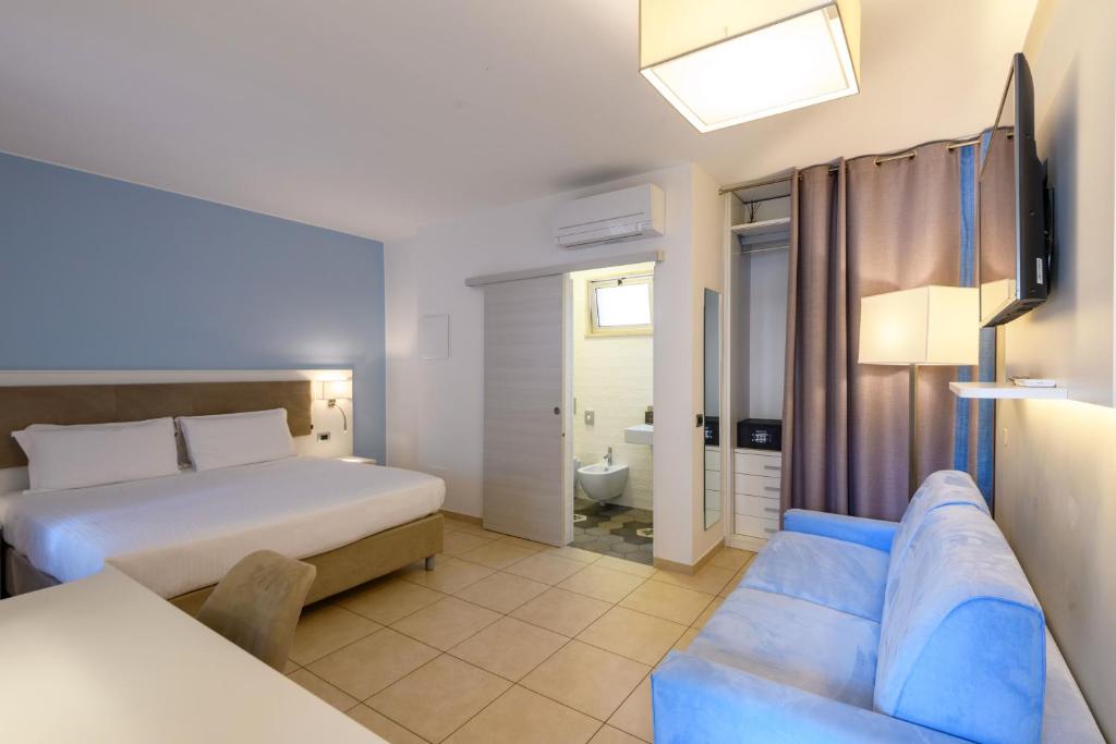 Postel nebo postele na pokoji v ubytování Hotel & Apartments Sasso