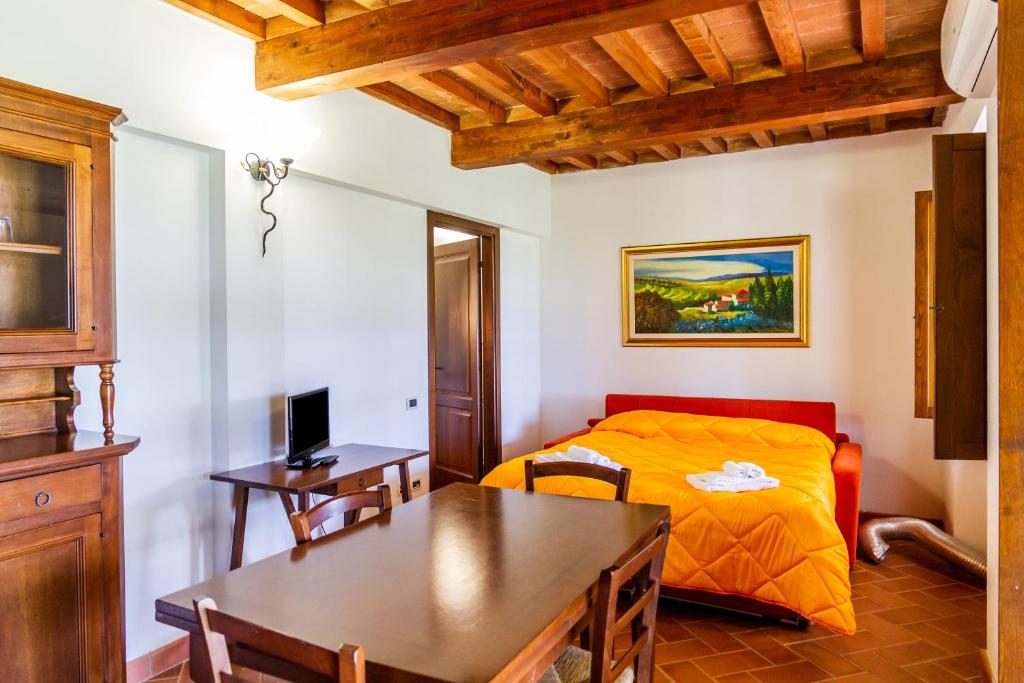A bed or beds in a room at Casa Vacanza Il Carpignone 1
