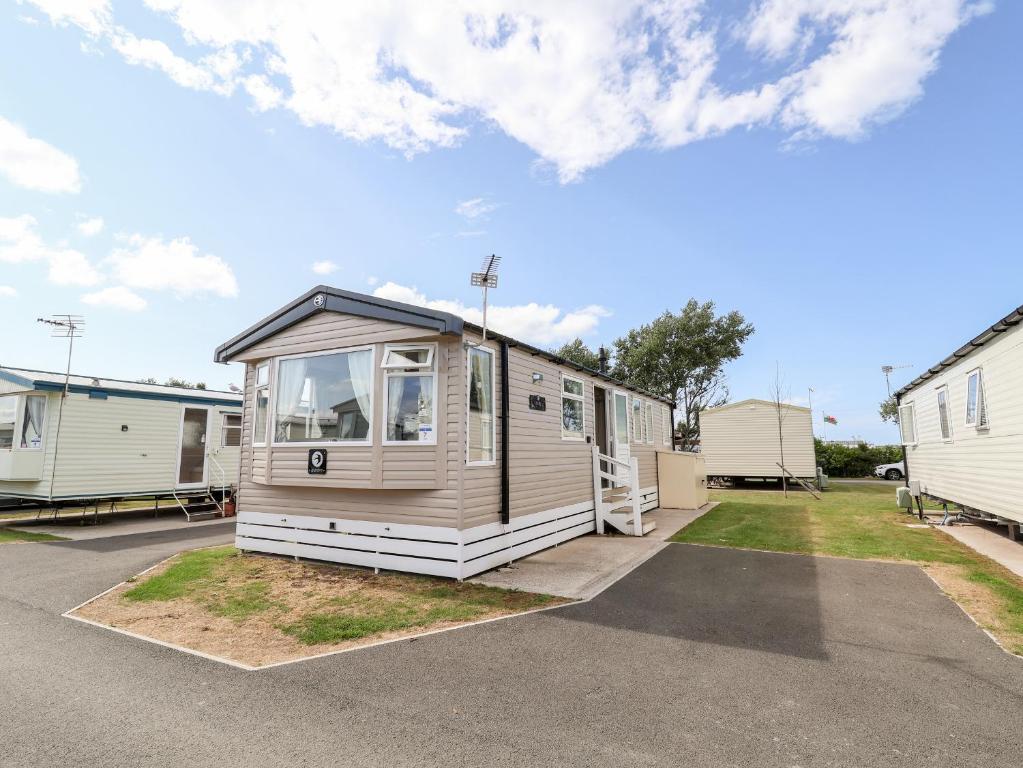 a mobile home parked in a parking lot at ABCVan in Abergele