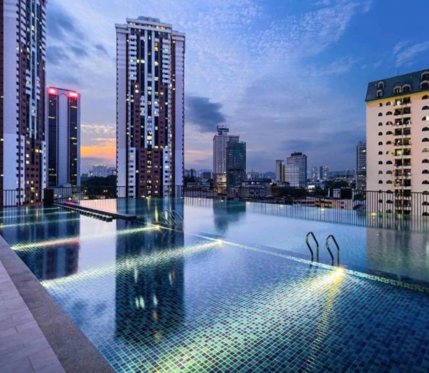 a swimming pool on the roof of a building at Chambers Suites KL - by Staycation Homes in Kuala Lumpur