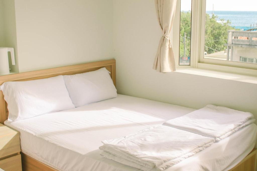 Postel nebo postele na pokoji v ubytování TETE Homestay