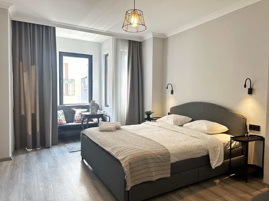 En eller flere senge i et værelse på The Diderot Hotel