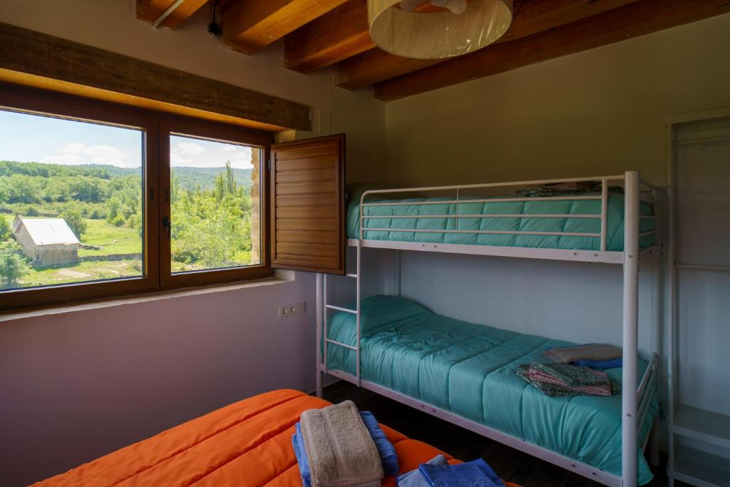 Postel nebo postele na pokoji v ubytování Casa Barambán