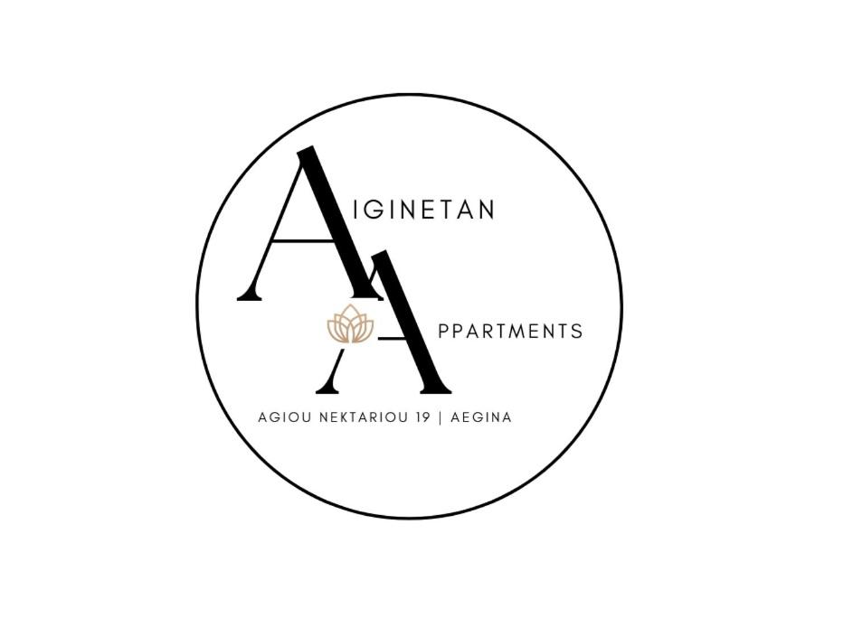 a letter logo in a circle at Aiginetan Apartments in Aegina Town
