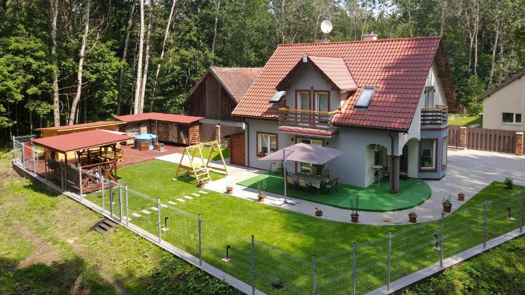 an aerial view of a house with a playground at Dom Na Skraju Mazur in Olsztyn