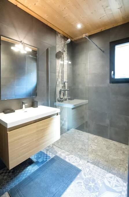 a bathroom with a sink and a shower at HaKaJu Appartement 10 personnes à Val Cenis in Lanslebourg-Mont-Cenis