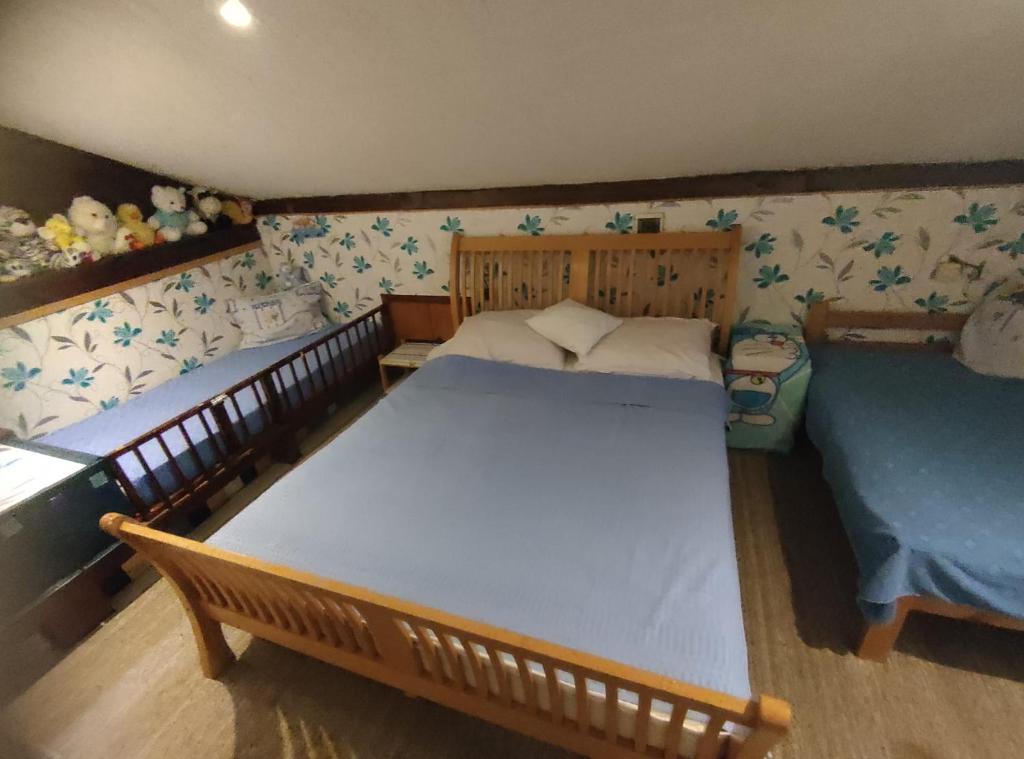 Postel nebo postele na pokoji v ubytování Apartmani Fortunela