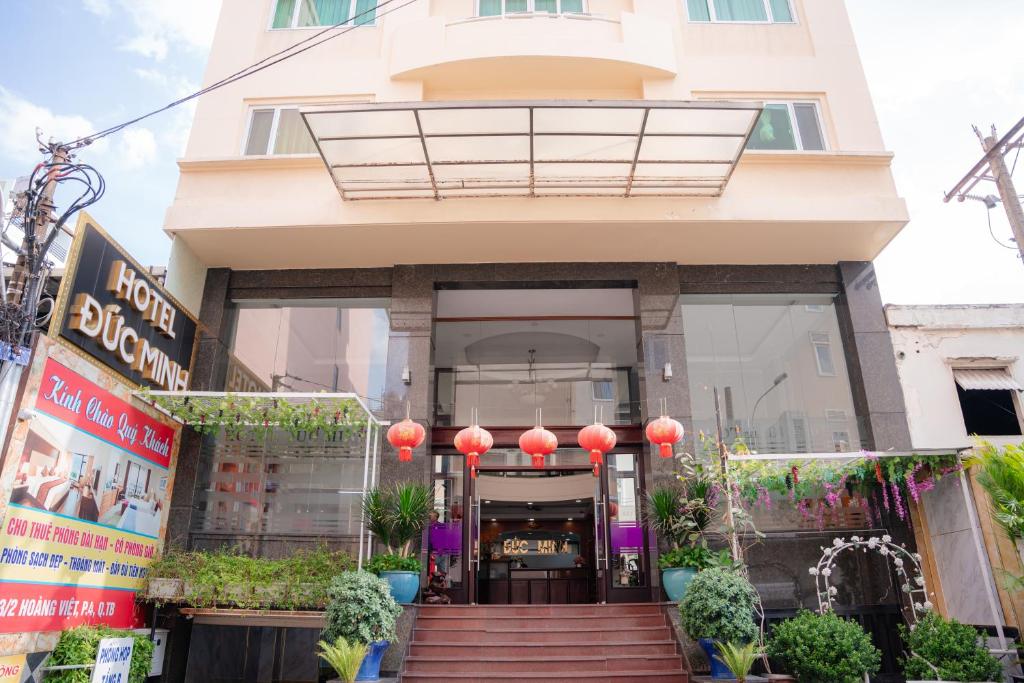 a store front of a building with red lanterns at DUC MINH HOTEL in Ho Chi Minh City