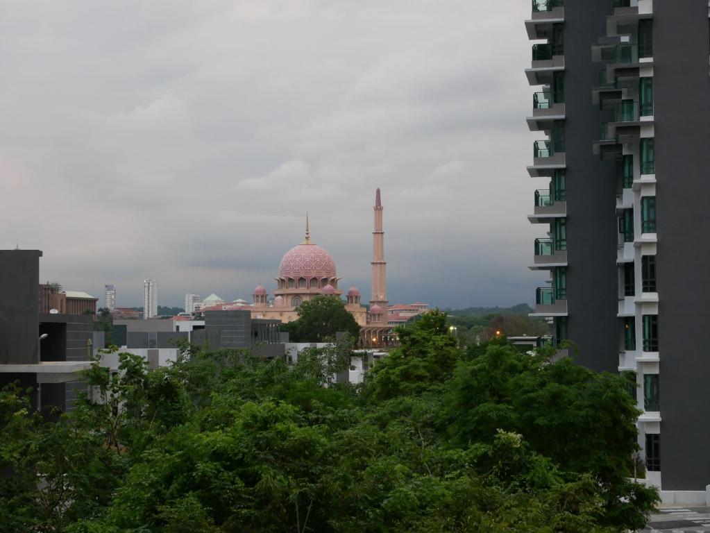 a mosque in a city with trees and buildings at Jome Putrajaya Presint 8 Natural Homestay in Putrajaya