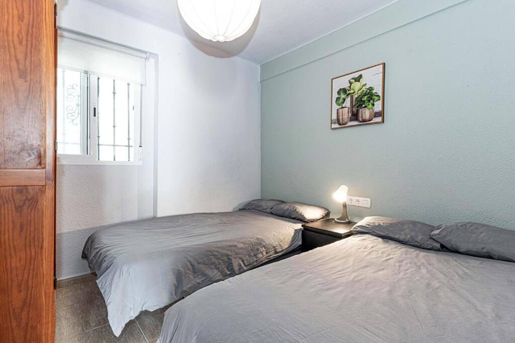 Postel nebo postele na pokoji v ubytování Sea Apartment Torre del Mar