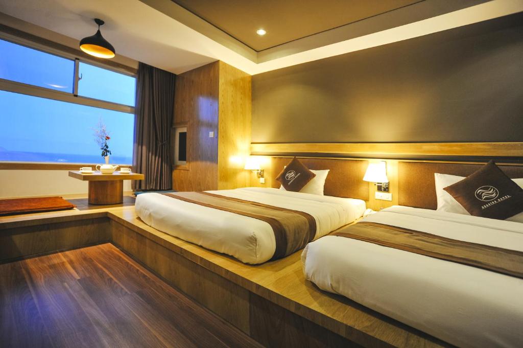 Postel nebo postele na pokoji v ubytování Seasing Boutique Hotel