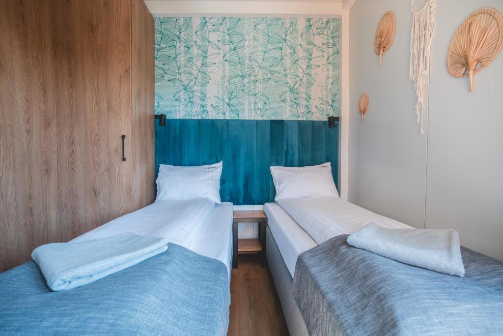 Postel nebo postele na pokoji v ubytování RResort - Domki z KRYTYM i PODGRZEWANYM BASENEM, Sauna, WiFi, parking w cenie!
