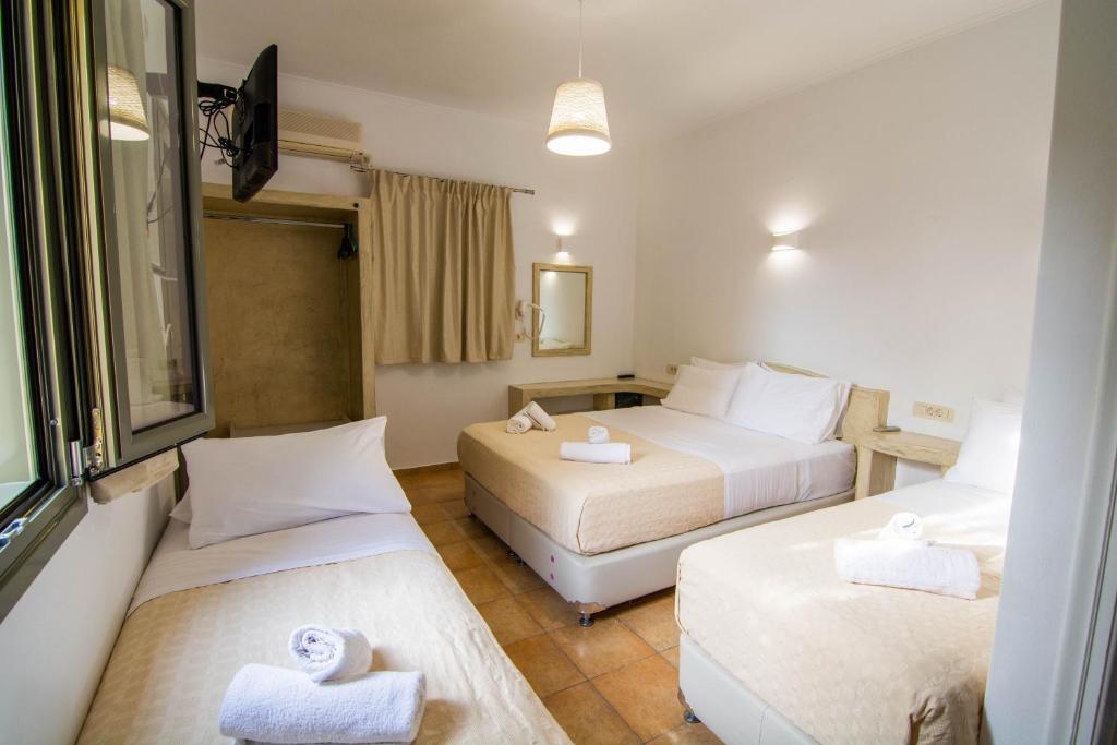 Ένα ή περισσότερα κρεβάτια σε δωμάτιο στο Phevos Villa