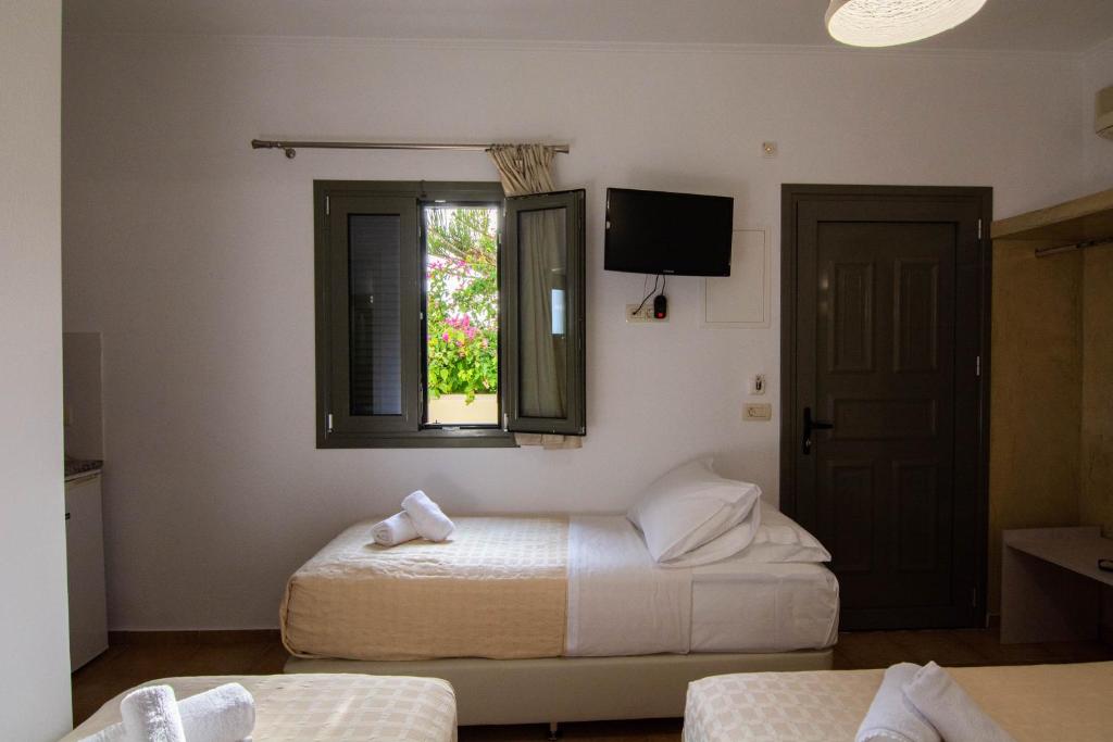 Ένα ή περισσότερα κρεβάτια σε δωμάτιο στο Phevos Villa