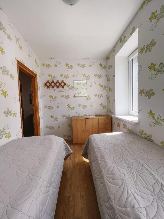 Postel nebo postele na pokoji v ubytování Apartment Jūros Mėlis