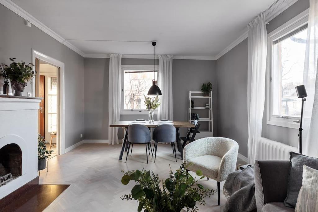 a living room with a table and chairs at Amazing family home in Stockholm in Stockholm