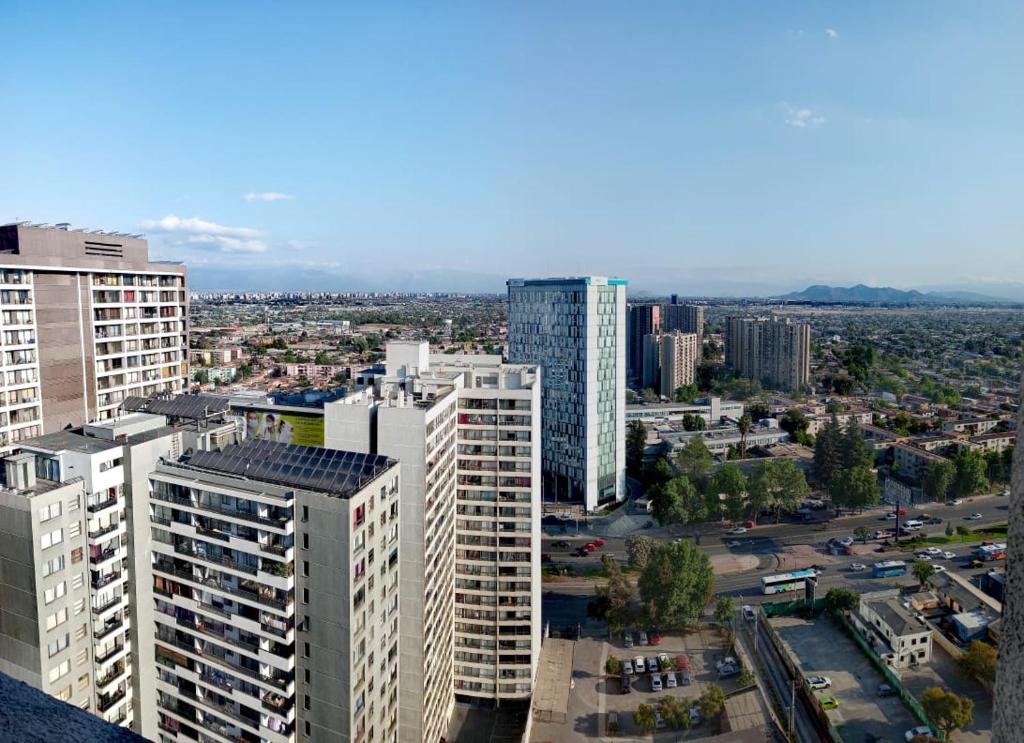 an aerial view of a city with tall buildings at Departamento Equipado (Estación Central) in Santiago