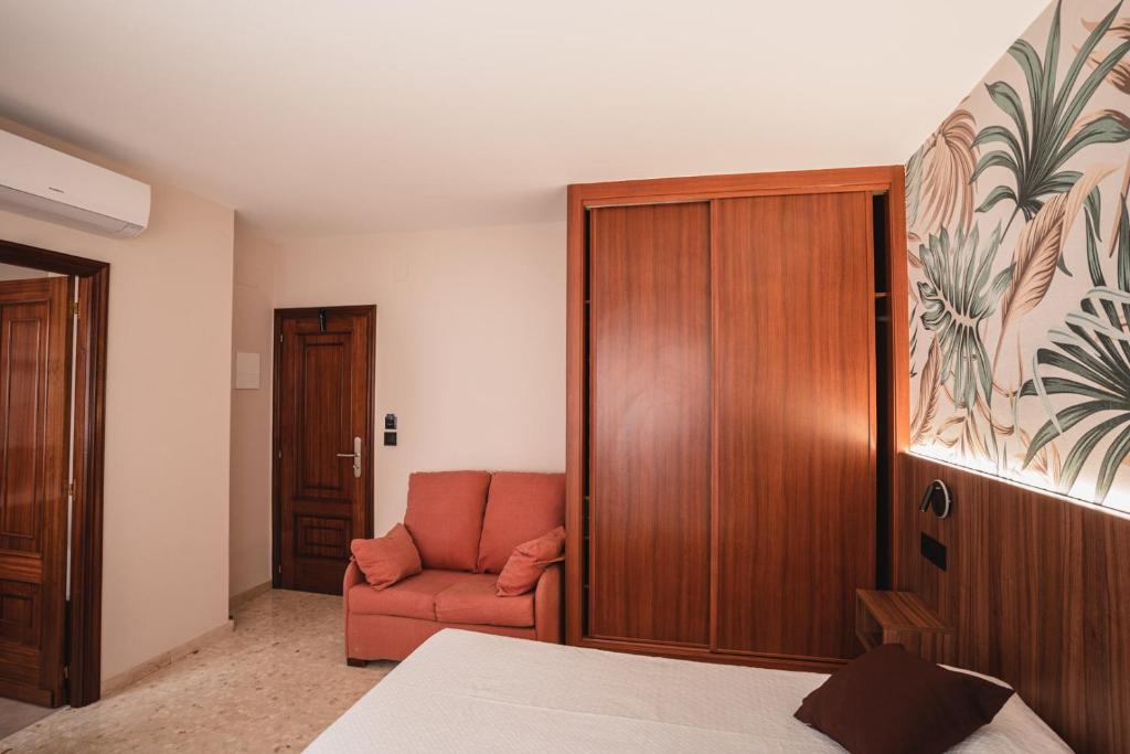 A bed or beds in a room at Hotel Xunqueira