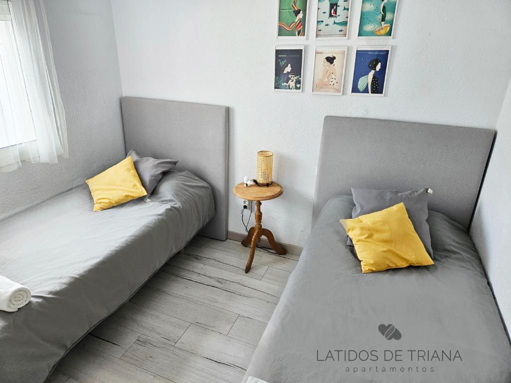 Postel nebo postele na pokoji v ubytování Latidos de Triana - Apartamento en Triana totalmente equipado